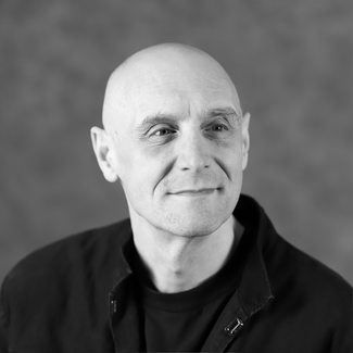 Black and white photo of Kevin Mazutinec, department technician, professor